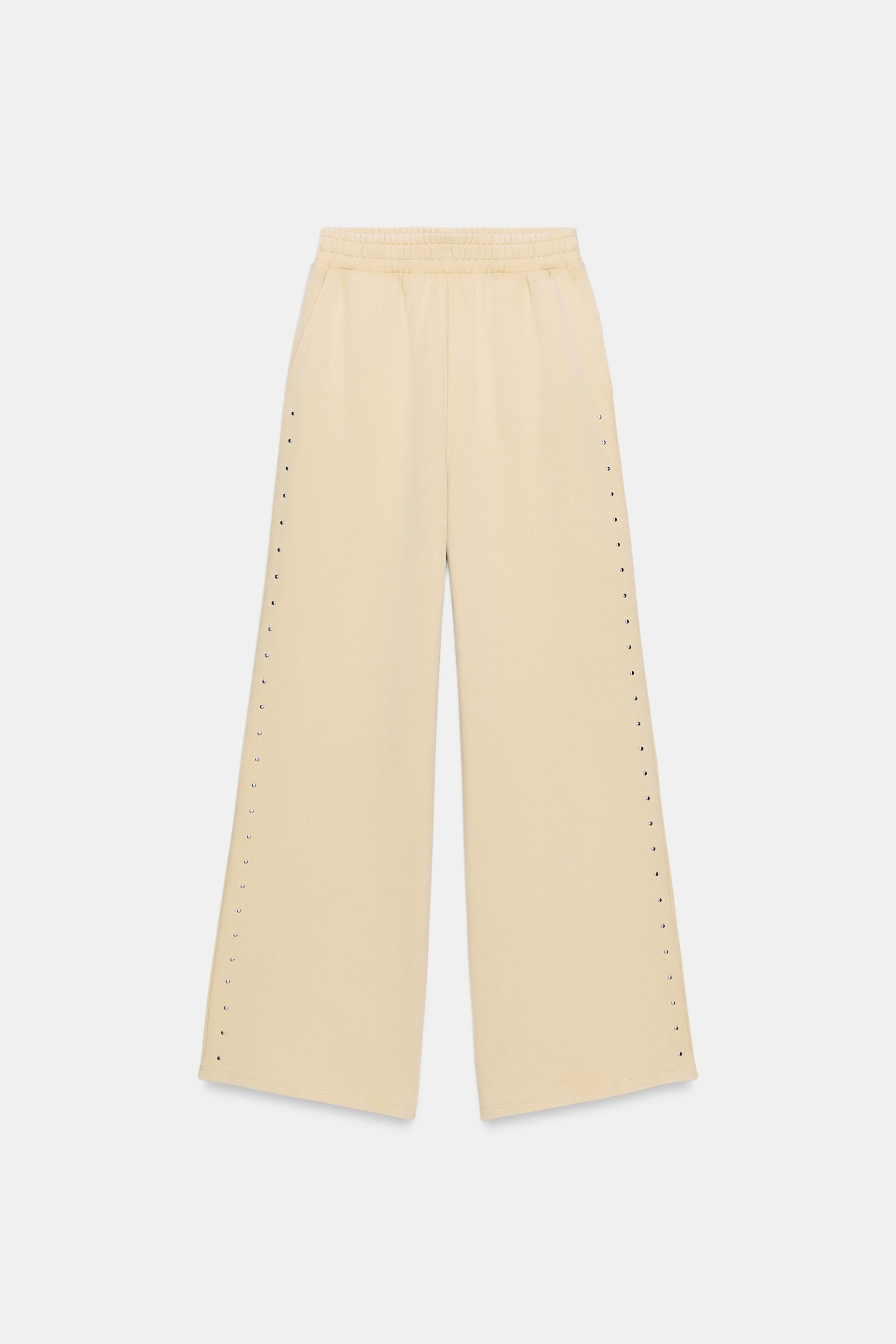 PANTALON EN MOLLETON EFFET DÉLAVÉ CLOUS